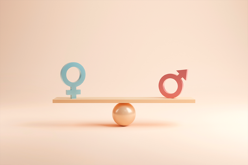 Balança em equilíbrio com símbolos femininos e masculino